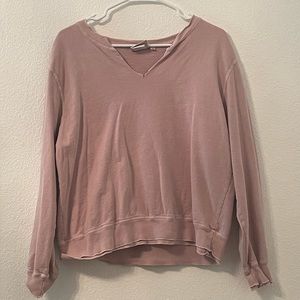 A dark pink sweater with double collar and sleeve endings